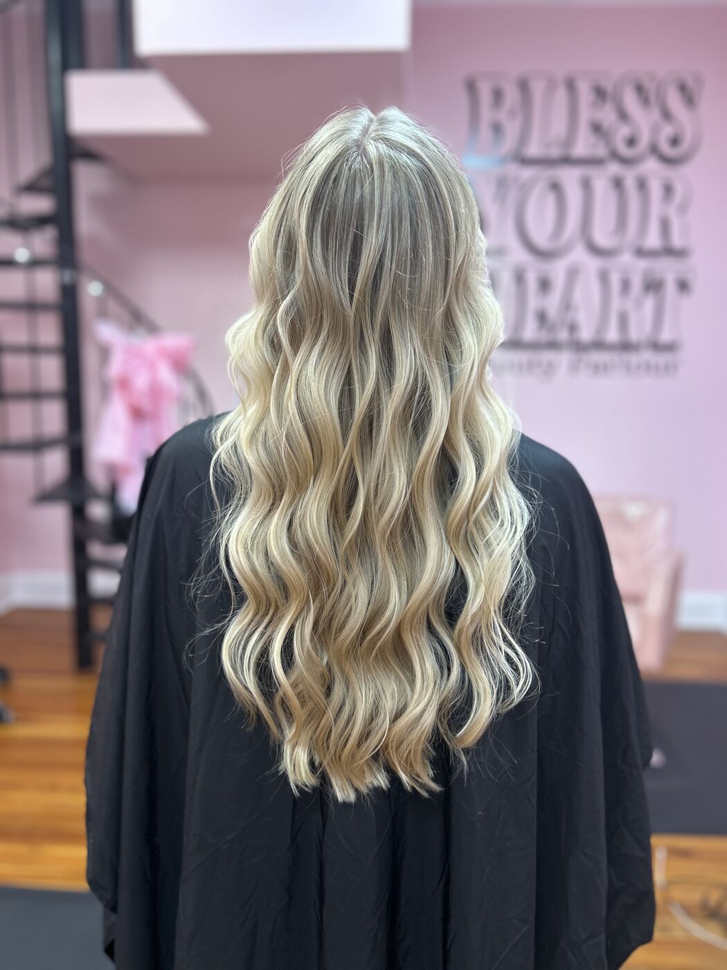 Bright blended blonde highlights with long waves by Kylie